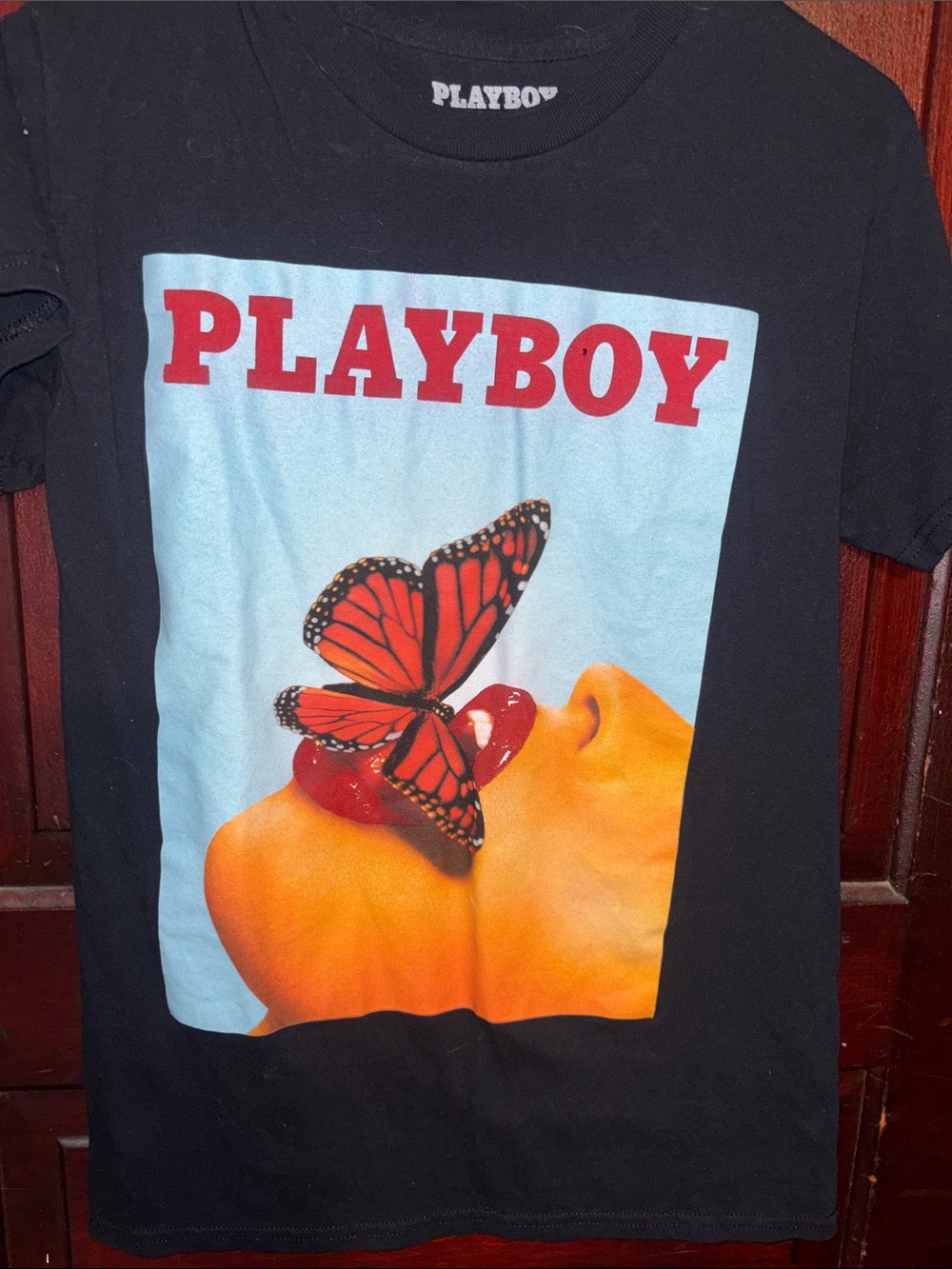 PLAYBOY Black Tee with Red Logo and Orange Butterfly Art